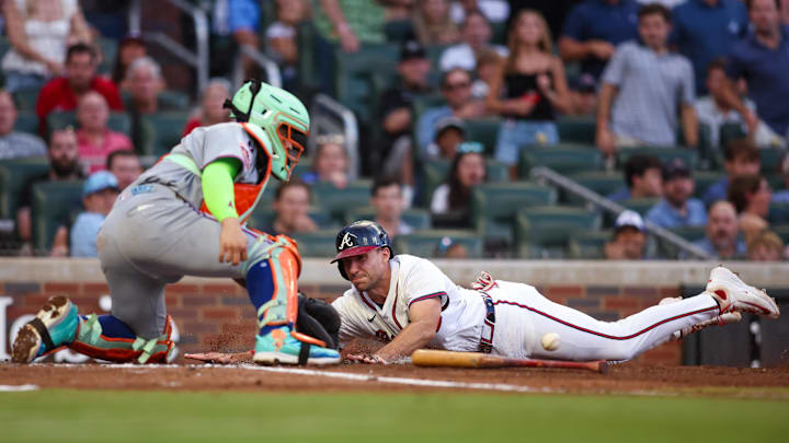 Jun 19, 2025; Atlanta, Georgia, USA; Atlanta Braves first baseman Matt Olson (28) slides safely past New York Mets catcher Francisco Alvarez (4) in the fourth inning at Truist Park. Mandatory Credit: Brett Davis-Imagn Images
Jun 19, 2025; Atlanta, Georgia, USA; Atlanta Braves first baseman Matt Olson (28) slides safely past New York Mets catcher Francisco Alvarez (4) in the fourth inning at Truist Park. Mandatory Credit: Brett Davis-Imagn Images