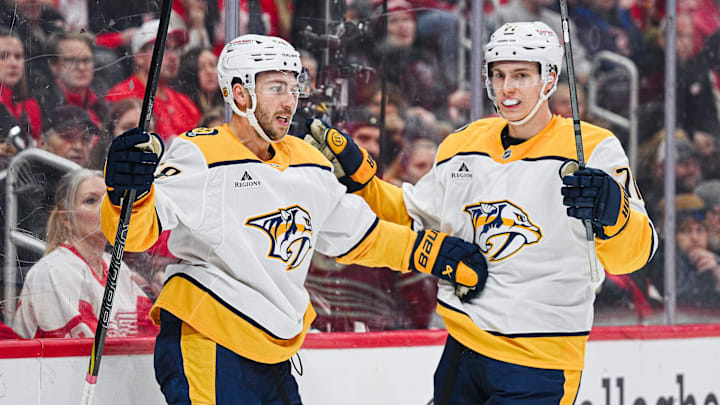 Nov 26, 2025; Detroit, Michigan, USA; Nashville Predators left wing Michael Bunting (58) celebrates his goal with right wing Matthew Wood (71) during the first period against the Detroit Red Wings at Little Caesars Arena. Mandatory Credit: Tim Fuller-Imagn Images Nov 26, 2025; Detroit, Michigan, USA; Nashville Predators left wing Michael Bunting (58) celebrates his goal with right wing Matthew Wood (71) during the first period against the Detroit Red Wings at Little Caesars Arena. Mandatory Credit: Tim Fuller-Imagn Images
