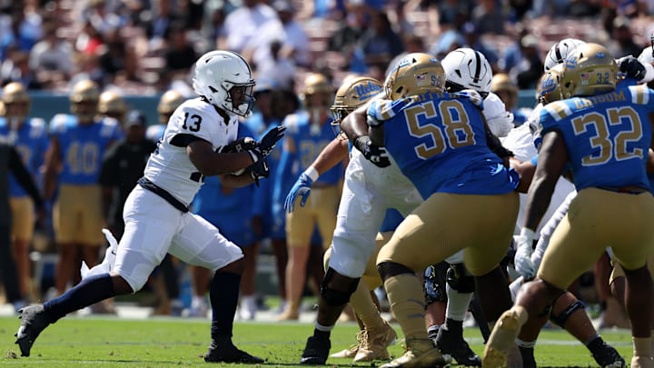 Penn State Nittany Lions running back Kaytron Allen (13) runs for a touchdown during the first quarter against the UCLA Bruins at the Rose Bowl. Penn State Nittany Lions running back Kaytron Allen (13) runs for a touchdown during the first quarter against the UCLA Bruins at the Rose Bowl.