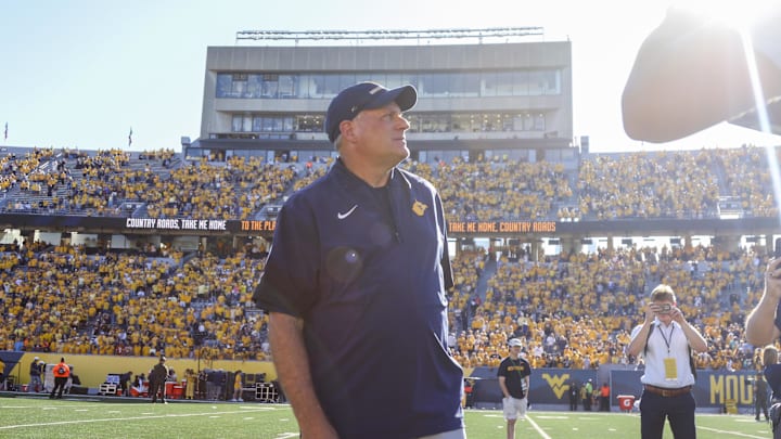Aug 30, 2025; Morgantown, West Virginia, USA; West Virginia Mountaineers head coach Rich Rodriguez sings “Country Roads” after defeating the Robert Morris Colonials at Milan Puskar Stadium. Mandatory Credit: Ben Queen-Imagn Images