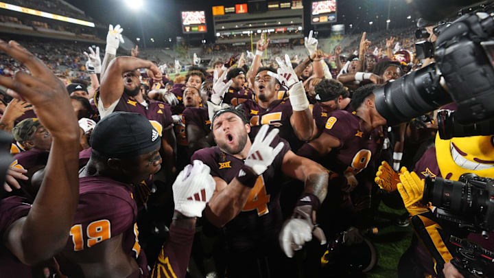Arizona State running back Cam Skattebo (4) celebrates with his teammates after their 35-31 win against the Kansas Jayhawks at Mountain America Stadium on Oct. 5, 2024.