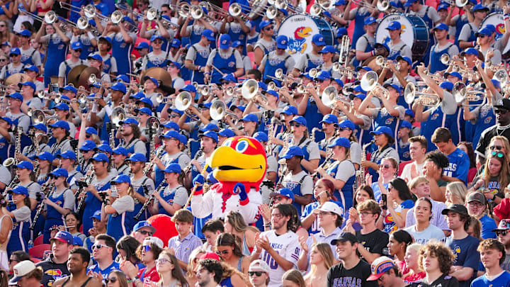 Sep 28, 2024; Kansas City, Missouri, USA; The Kansas Jayhawks mascot sits among the marching band during the second half of the game against the TCU Horned Frogs at GEHA Field at Arrowhead Stadium. Mandatory Credit: Denny Medley-Imagn Images Sep 28, 2024; Kansas City, Missouri, USA; The Kansas Jayhawks mascot sits among the marching band during the second half of the game against the TCU Horned Frogs at GEHA Field at Arrowhead Stadium. Mandatory Credit: Denny Medley-Imagn Images