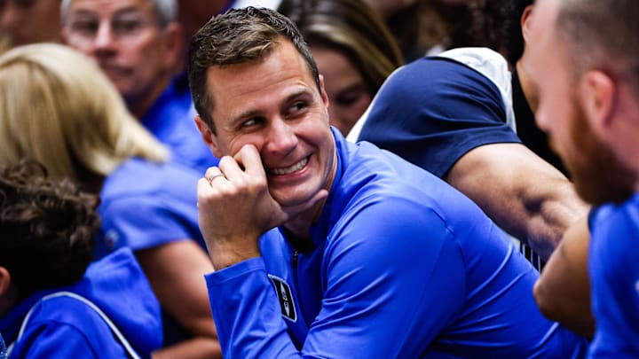 Oct 3, 2025; Durham, NC, USA; Duke Blue Devils head coach Jon Scheyer smiles during the Countdown to Craziness at the Cameron Indoor Stadium. Oct 3, 2025; Durham, NC, USA; Duke Blue Devils head coach Jon Scheyer smiles during the Countdown to Craziness at the Cameron Indoor Stadium.