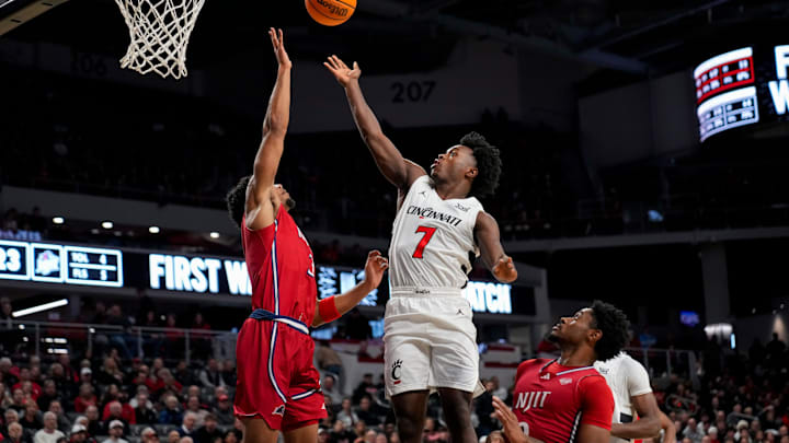 Cincinnati Bearcats guard Keyshuan Tillery (7) lays up a shot against NJIT Highlanders forward Jordan Rogers (3) in the first half of the NCAA men’s basketball game between the Cincinnati Bearcats and the NJIT Highlanders at Fifth Third Arena in Cincinnati on Monday, Nov. 24, 2025. Cincinnati Bearcats guard Keyshuan Tillery (7) lays up a shot against NJIT Highlanders forward Jordan Rogers (3) in the first half of the NCAA men’s basketball game between the Cincinnati Bearcats and the NJIT Highlanders at Fifth Third Arena in Cincinnati on Monday, Nov. 24, 2025.
