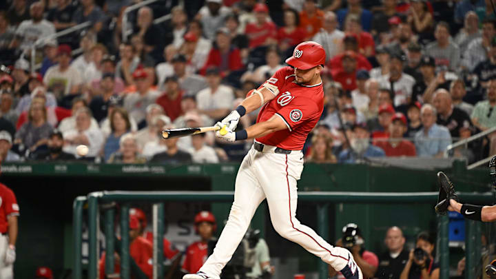 Jul 2, 2025; Washington, District of Columbia, USA; Washington Nationals first baseman Nathaniel Lowe (33) hits a three run triple against the Detroit Tigers during the eighth inning at Nationals Park.