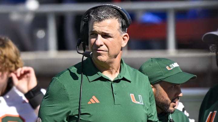 Nov 1, 2025; Dallas, Texas, USA;  Miami Hurricanes head coach Mario Cristobal looks on during the game between the Mustangs and the Hurricanes at Gerald J. Ford Stadium. Mandatory Credit: Jerome Miron-Imagn Images
