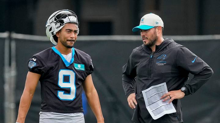 Carolina Panthers quarterback Bryce Young (9) chats with quarterbacks coach Will Harriger Carolina Panthers quarterback Bryce Young (9) chats with quarterbacks coach Will Harriger
