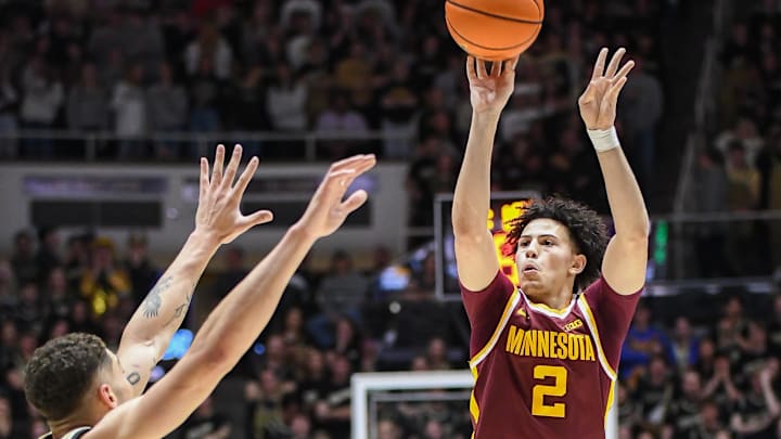 Feb 15, 2024; West Lafayette, Indiana, USA; Minnesota Golden Gophers guard Mike Mitchell Jr. (2) attempts a shot over Purdue Boilermakers forward Mason Gillis (0) during the first half at Mackey Arena. Mandatory Credit: Robert Goddin-Imagn Images Feb 15, 2024; West Lafayette, Indiana, USA; Minnesota Golden Gophers guard Mike Mitchell Jr. (2) attempts a shot over Purdue Boilermakers forward Mason Gillis (0) during the first half at Mackey Arena. Mandatory Credit: Robert Goddin-Imagn Images