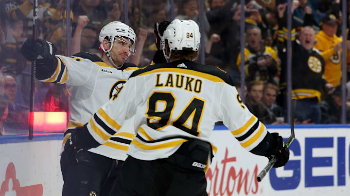 Mar 19, 2023; Buffalo, New York, USA;  Boston Bruins right wing Garnet Hathaway (21) celebrates his goal with center Jakub Lauko (94) during the first period against the Buffalo Sabres at KeyBank Center. Mandatory Credit: Timothy T. Ludwig-Imagn Images