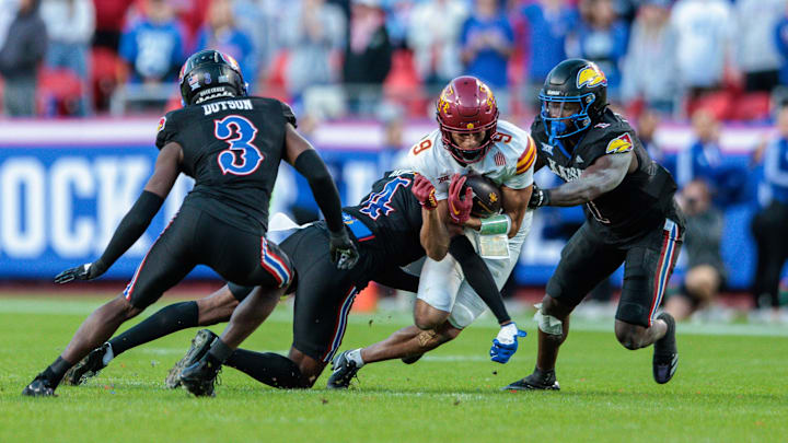 Jayden Higgins works for yards against Kansas on Saturday during a loss by Iowa State. 