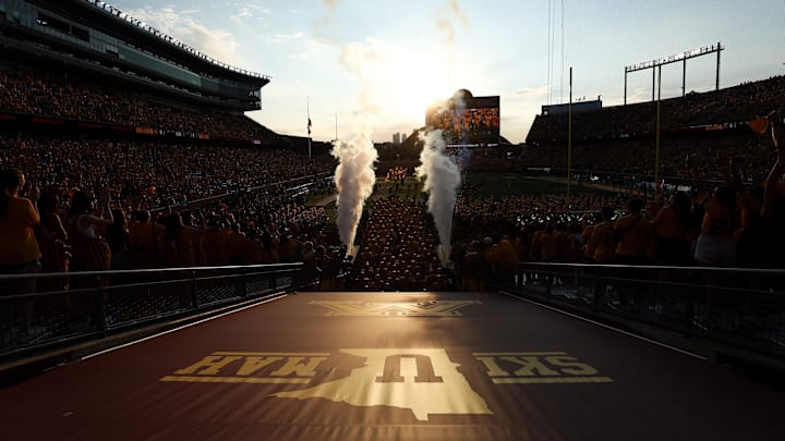 Aug 28, 2025; Minneapolis, Minnesota, USA; Minnesota Golden Gophers players take the field before the game against the Buffalo Bulls at Huntington Bank Stadium. Mandatory Credit: Matt Krohn-Imagn Images