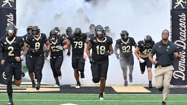 Sep 27, 2025; Winston-Salem, North Carolina, USA;  The Wake Forest Demon Deacons take the field against the Georgia Tech Yellow Jackets at Allegacy Federal Credit Union Stadium. Mandatory Credit: Zachary Taft-Imagn Images