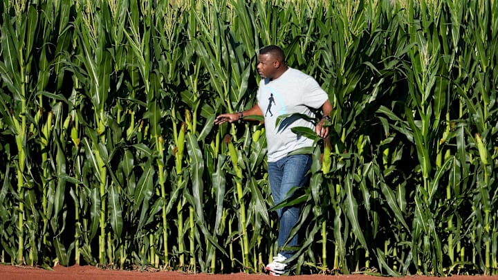 Hall of Fame baseball player and former Cincinnati Reds center fielder Ken Griffey Jr. enters the field through the corn stalks into right field for a pregame catch with his father, Ken Griffey Sr., before a baseball game between the Chicago Cubs and the Cincinnati Reds, Thursday, Aug. 11, 2022, at the MLB Field of Dreams stadium in Dyersville, Iowa.

Mlb Field Of Dreams Game Cincinnati Reds At Chicago Cubs Aug 11 1283