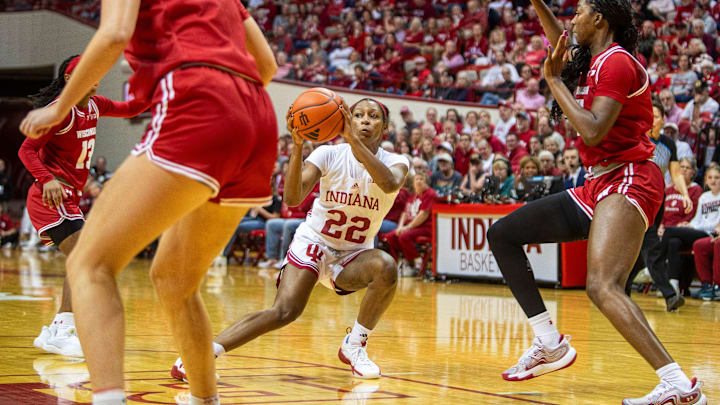 Indiana's Chloe Moore-McNeil (22) fakes a pass during the Indiana versus Wisconsin women's basketball game at Simon Skjodt Assembly Hall on Saturday, Dec. 28, 2024.