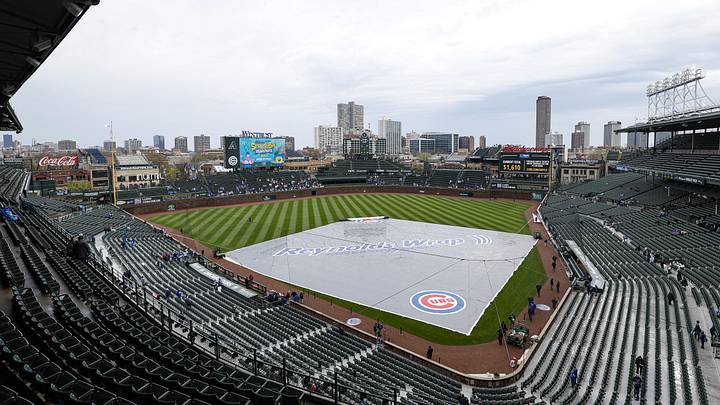 Apr 20, 2025; Chicago, Illinois, USA; A rain tarp keeps the infield dry before a delayed baseball game between the Chicago Cubs and Arizona Diamondbacks at Wrigley Field. Mandatory Credit: Kamil Krzaczynski-Imagn Images