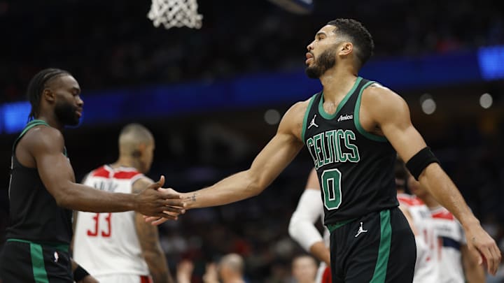 Oct 24, 2024; Washington, District of Columbia, USA; Boston Celtics forward Jayson Tatum (0) celebrates with Celtics guard Jaylen Brown (7) against the Washington Wizards in the first half at Capital One Arena. Mandatory Credit: Geoff Burke-Imagn Images