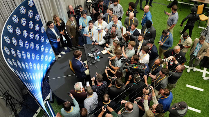 July 15, 2025; Atlanta, GA, USA; Texas quarterback Arch Manning is surrounded by media as he participates in SEC Media Days at the College Football Hall of Fame in Atlanta.