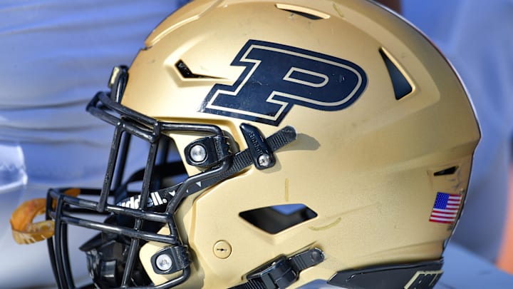 A Purdue Boilermakers helmet sits ready on the bench 
