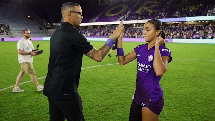 Nov 8, 2024; Orlando, Florida, USA; Orlando Pride head coach Seb Hines and forward Ally Watt (11) celebrate after defeating the Chicago Red Stars in a 2024 NWSL Playoffs quarterfinal match at Inter&Co Stadium. Mandatory Credit: Mike Watters-Imagn Images