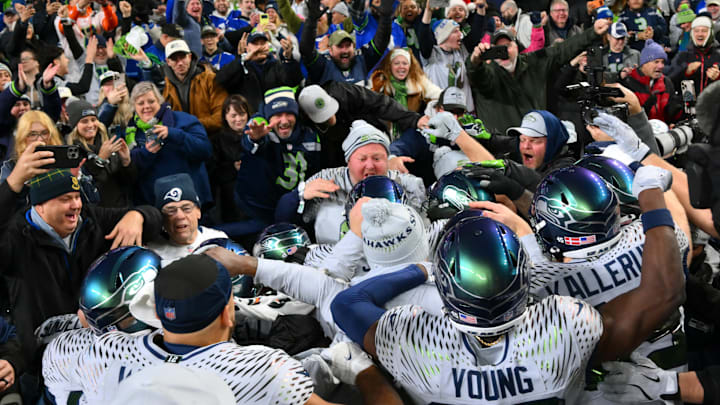 Dec 18, 2025; Seattle, Washington, USA; Seattle Seahawks celebrate with fans after defeating the Los Angeles Rams in overtime at Lumen Field. Mandatory Credit: Steven Bisig-Imagn Images