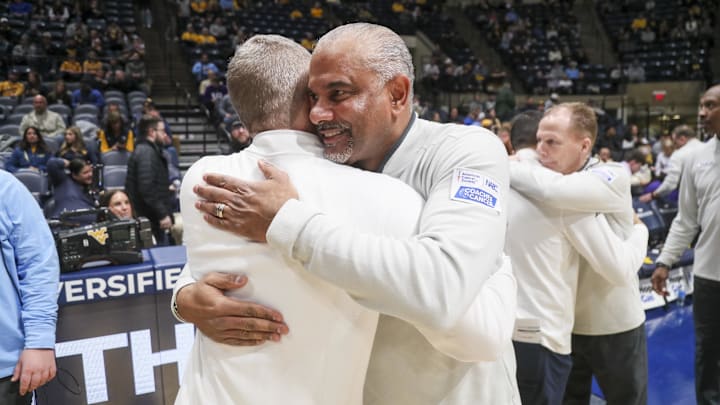 Jan 27, 2026; Morgantown, West Virginia, USA; Kansas State Wildcats head coach Jerome Tang talks with West Virginia Mountaineers head coach Ross Hodge before the game at Hope Coliseum. Mandatory Credit: Ben Queen-Imagn Imagesa Jan 27, 2026; Morgantown, West Virginia, USA; Kansas State Wildcats head coach Jerome Tang talks with West Virginia Mountaineers head coach Ross Hodge before the game at Hope Coliseum. Mandatory Credit: Ben Queen-Imagn Imagesa