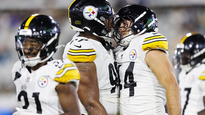 Steelers DeMarvin Leal (98) and Carson Bruener (44) celebrate a tackle against the Jacksonville Jaguars . Steelers DeMarvin Leal (98) and Carson Bruener (44) celebrate a tackle against the Jacksonville Jaguars .