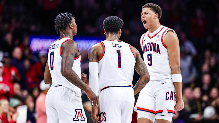 Arizona Wildcats guard Caleb Love (1) celebrates a three-point basket with his teammates Jaden Bradley (0) and Carter Bryant (3). Arizona Wildcats guard Caleb Love (1) celebrates a three-point basket with his teammates Jaden Bradley (0) and Carter Bryant (3).