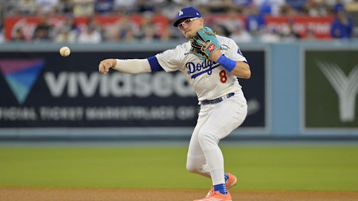 Los Angeles, California, USA; Los Angeles Dodgers utility man Enrique Hernandez (8) throws to first for an out against New York Yankees second baseman Gleyber Torres (not pictured) in the third inning during Game 2 of the 2024 MLB World Series at Dodger Stadium.