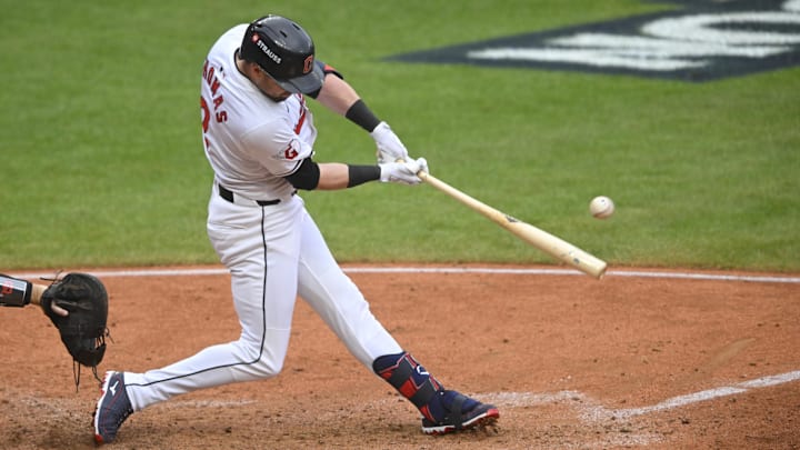 Oct 12, 2024; Cleveland, Ohio, USA; Cleveland Guardians outfielder Lane Thomas (8) gets a hit in the seventh inning against the Detroit Tigers during game five of the ALDS for the 2024 MLB Playoffs at Progressive Field. Mandatory Credit: David Richard-Imagn Images