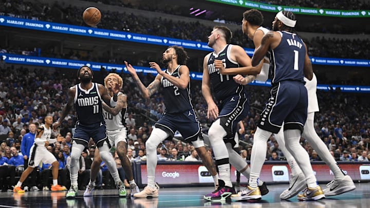 Oct 24, 2024; Dallas, Texas, USA; Dallas Mavericks guard Kyrie Irving (11) and center Dereck Lively II (2) and guard Luka Doncic (77) and guard Jaden Hardy (1) and San Antonio Spurs forward Jeremy Sochan (10) and center Victor Wembanyama (1) look for the ball during the second quarter at the American Airlines Center.