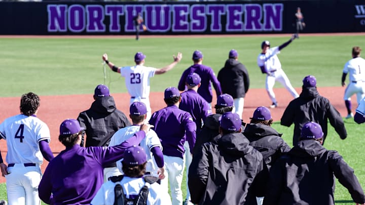 Northwestern players and staff run to greet infielder Trent Liolios after he hit a walk-off double in the series finale against Illinois on March 22, 2025. Northwestern players and staff run to greet infielder Trent Liolios after he hit a walk-off double in the series finale against Illinois on March 22, 2025.