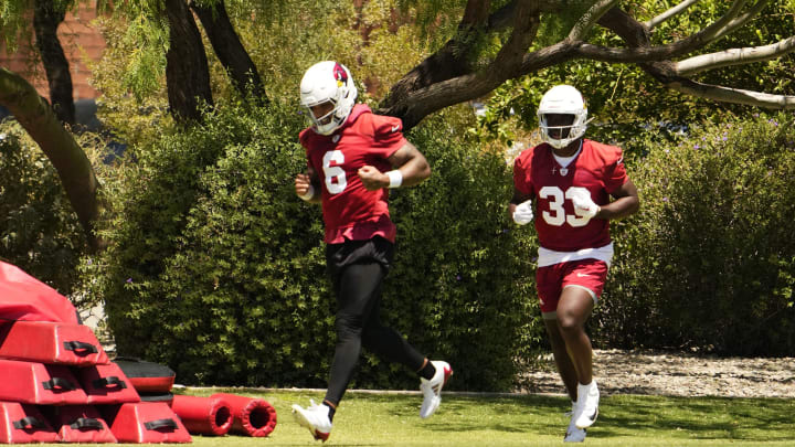 Arizona Cardinals running backs James Conner (6) and Trey Benson (33) during organized team activities at the Dignity Health Arizona Cardinals Training Center on May 28, 2024.