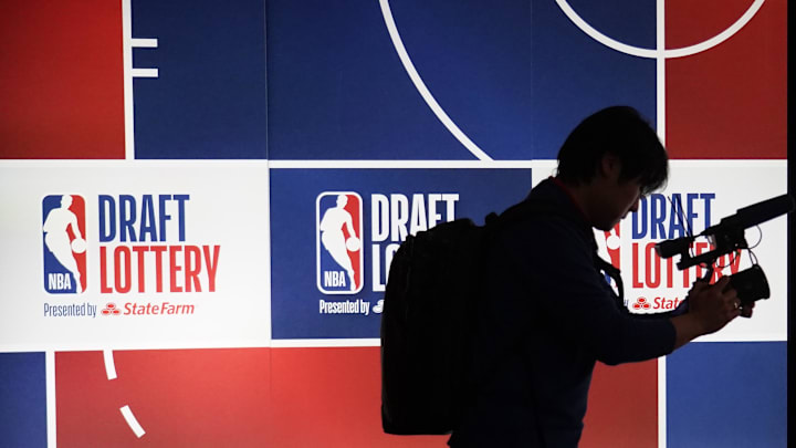 May 12, 2025; Chicago, Illinois, US; Andrew Kim of the Philadelphia 76ers videos during the 2025 NBA Draft Lottery at McCormick Place. Mandatory Credit: David Banks-Imagn Images