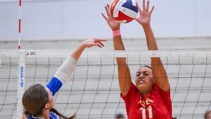 Divine Savior Holy Angels' Callie Carr (11) blocks a shot during a match in the 2025 Joust volleyball tournament at Homestead High School in Mequon, Wisconsin on Saturday, Aug. 30. 