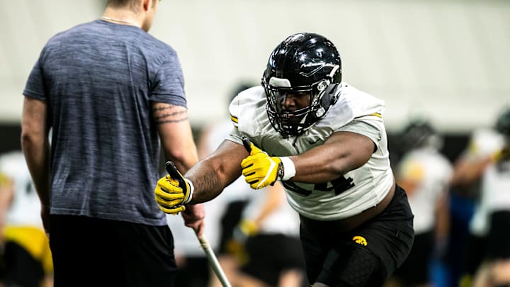 Iowa defensive lineman Anterio Thompson (54) runs a drill during a spring NCAA football practice, Thursday, March 30, 2023, at the University of Iowa Indoor Practice Facility in Iowa City, Iowa.

230330 Iowa Spring Fb 055 Jpg