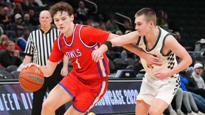 Slinger's Joey Kohnen (1) breaks past Freedom's Cal Calhoon (2) during the Deer District Prep Showcase game at Fiserv Forum in Milwaukee, Wisconsin, Jan. 24. Slinger won the game, 58-38.