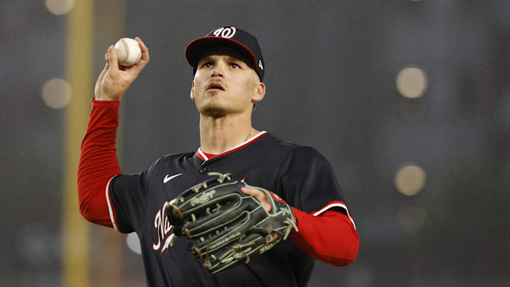Jun 16, 2025; Washington, District of Columbia, USA; Washington Nationals third baseman Brady House (55) throws a ball into the stands at the end of the sixth inning against the Colorado Rockies at Nationals Park. 