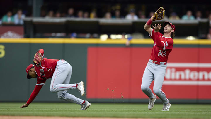 Sep 14, 2025; Seattle, Washington, USA; Los Angeles Angels second baseman Christian Moore (4) backs away as Los Angeles Angels center fielder Bryce Teodosio (22) catches Seattle Mariners left fielder Randy Arozarena (56) during the seventh inning at T-Mobile Park. Mandatory Credit: John Froschauer-Imagn Images Sep 14, 2025; Seattle, Washington, USA; Los Angeles Angels second baseman Christian Moore (4) backs away as Los Angeles Angels center fielder Bryce Teodosio (22) catches Seattle Mariners left fielder Randy Arozarena (56) during the seventh inning at T-Mobile Park. Mandatory Credit: John Froschauer-Imagn Images