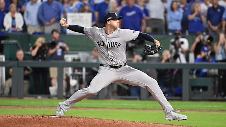 Oct 9, 2024; Kansas City, Missouri, USA; New York Yankees relief pitcher Clay Holmes (35) pitches in the in the fifth inning against the Kansas City Royals during game three of the NLDS for the 2024 MLB Playoffs at Kauffman Stadium. Mandatory Credit: Peter Aiken-Imagn Images