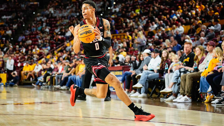 Mar 8, 2025; Tempe, Arizona, USA; Texas Tech Red Raiders guard Chance McMillian (0) moves the ball during the first half  at Desert Financial Arena. Mandatory Credit: Arianna Grainey-Imagn Images