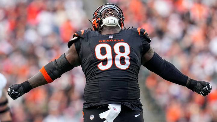 Cincinnati Bengals defensive tackle T.J. Slaton Jr. (98) celebrates after sacking Arizona Cardinals quarterback Jacoby Brissett. Cincinnati Bengals defensive tackle T.J. Slaton Jr. (98) celebrates after sacking Arizona Cardinals quarterback Jacoby Brissett.