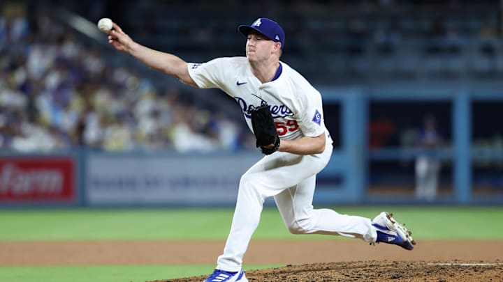 Sep 10, 2024; Los Angeles, California, USA;  Los Angeles Dodgers relief pitcher Evan Phillips (59) pitches during the eighth inning against the Chicago Cubs at Dodger Stadium. Mandatory Credit: Kiyoshi Mio-Imagn Images