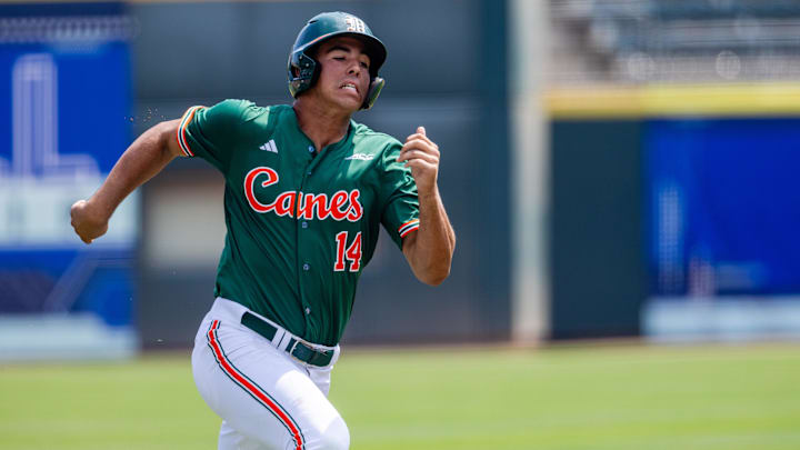 May 23, 2024; Charlotte, NC, USA; Miami (Fl) Hurricanes infielder Daniel Cuvet (14) runs home in the first inning against the Clemson Tigers during the ACC Baseball Tournament at Truist Field. Mandatory Credit: Scott Kinser-Imagn Images May 23, 2024; Charlotte, NC, USA; Miami (Fl) Hurricanes infielder Daniel Cuvet (14) runs home in the first inning against the Clemson Tigers during the ACC Baseball Tournament at Truist Field. Mandatory Credit: Scott Kinser-Imagn Images