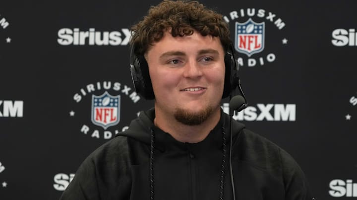 Feb 26, 2025; Indianapolis, IN, USA; Michigan defensive lineman Mason Graham (DL11) on the SiriusXM radio set during the 2025 NFL Scouting Combine at the Indiana Convention Center. Mandatory Credit: Kirby Lee-Imagn Images