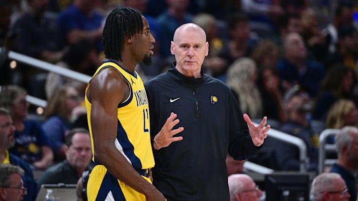 Oct 27, 2024; Indianapolis, Indiana, USA; Indiana Pacers Head Coach Rick Carlisle talks to forward Aaron Nesmith (23) during the first quarter against the Philadelphia 76ers at Gainbridge Fieldhouse. Mandatory Credit: Marc Lebryk-Imagn Images