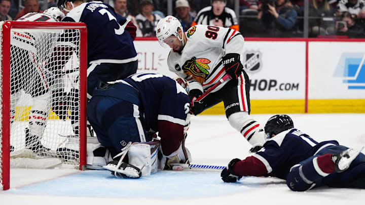 Mar 4, 2024; Denver, Colorado, USA; Chicago Blackhawks center Tyler Johnson (90) attempts to score
