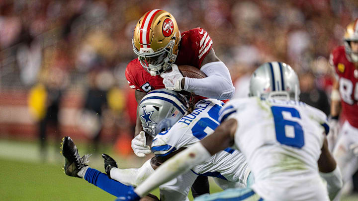 Dallas Cowboys safety Malik Hooker tackles San Francisco 49ers wide receiver Deebo Samuel. Dallas Cowboys safety Malik Hooker tackles San Francisco 49ers wide receiver Deebo Samuel.