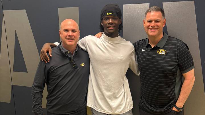 Lausanne Collegiate wide receiver Lawrence Britt (middle) alongside  Missouri Tigers offensive coordinator Chip Lindsey (left) and Missouri wide receivers coach Jacob Peeler (right). 