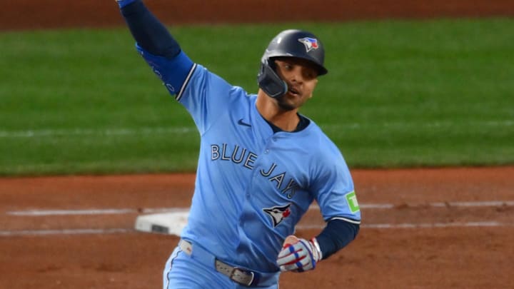 Oct 16, 2025; Seattle, Washington, USA; Toronto Blue Jays second baseman Andres Gimenez (0) reacts after hitting a two-run home run in the third inning in front of Seattle Mariners catcher Cal Raleigh (29) during game four of the ALCS round for the 2025 MLB playoffs at T-Mobile Park Oct 16, 2025; Seattle, Washington, USA; Toronto Blue Jays second baseman Andres Gimenez (0) reacts after hitting a two-run home run in the third inning in front of Seattle Mariners catcher Cal Raleigh (29) during game four of the ALCS round for the 2025 MLB playoffs at T-Mobile Park