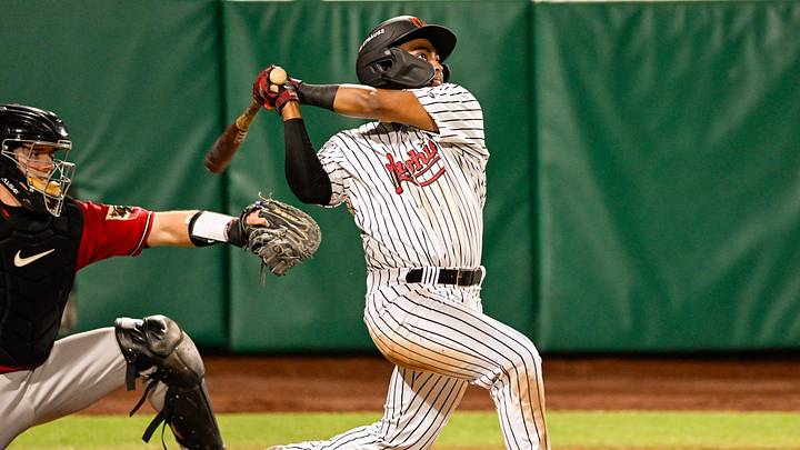 Visalia Rawhide's Kayson Cunningham watches his hit sail into the outfield against Fresno Grizzlies on Friday, April 3, 2026. Visalia Rawhide's Kayson Cunningham watches his hit sail into the outfield against Fresno Grizzlies on Friday, April 3, 2026.